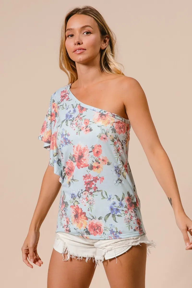Blue floral printed jersey knit ruffle sleeve top by Trendsi, featuring a relaxed fit and feminine ruffle details.