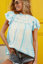 Light blue BiBi tiered ruffle neck tie-dye top from Trendsi, featuring layered ruffles and a stylish tie neckline.