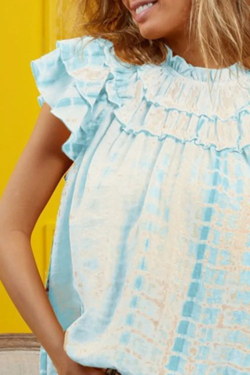 Blue tie-dye tiered ruffle neck top by Trendsi, featuring a chic, flowy design with ruffled accents and a stylish tie neckline.