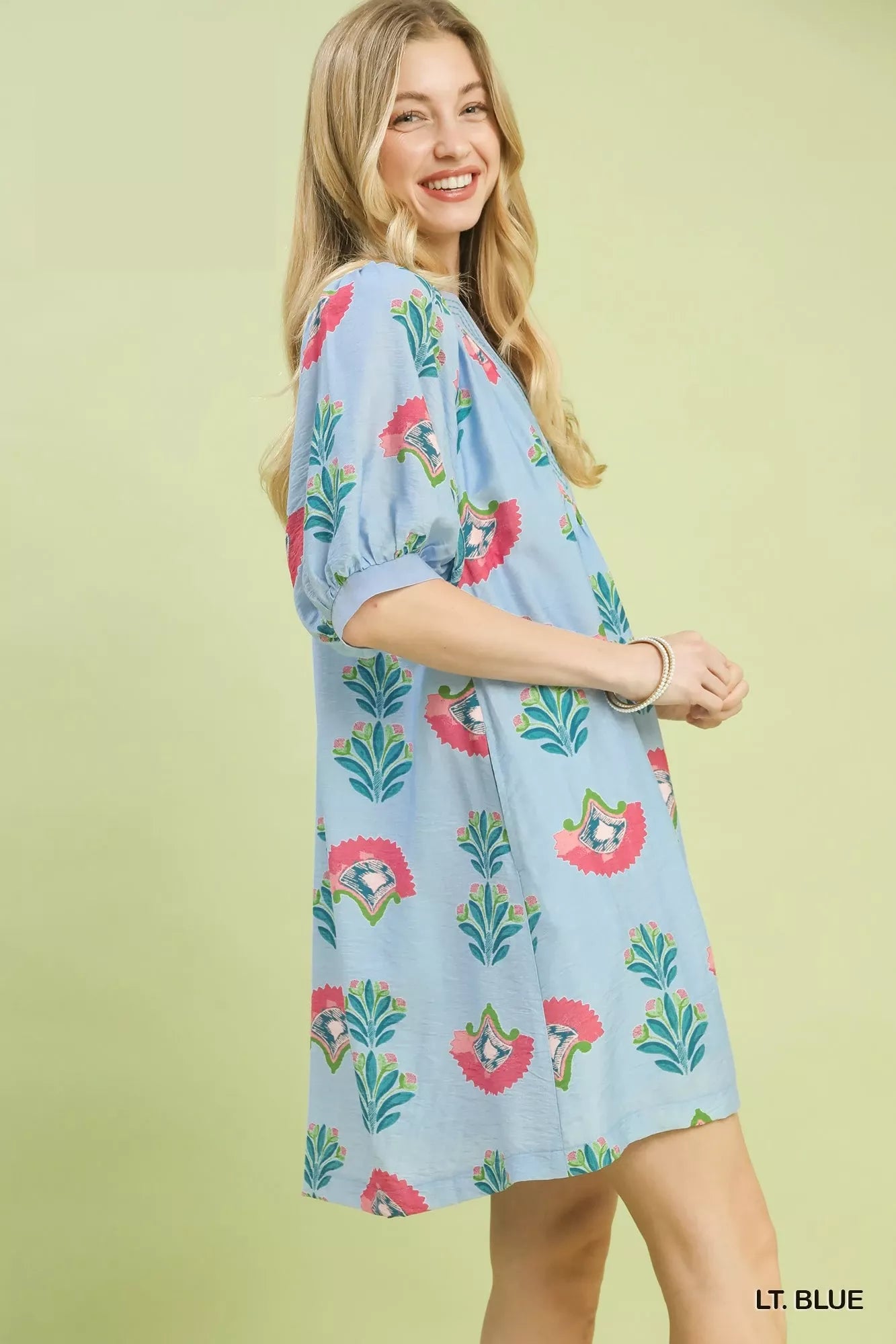 Light blue Umgee abstract print mini dress by Trendsi, featuring a stylish short dress with artistic patterns and a flattering fit.