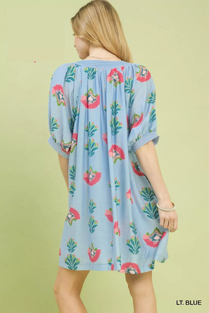 Light blue Umgee abstract print mini dress from Trendsi, featuring a stylish, flowy design and short sleeves.