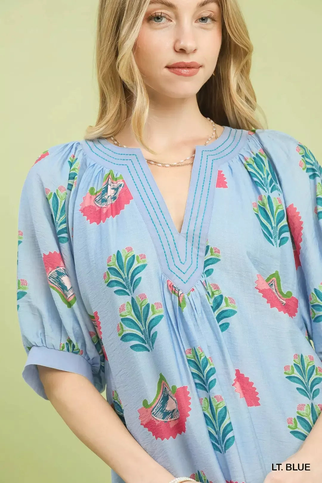 Light blue Umgee abstract print mini dress by Trendsi, featuring short sleeves and a stylish, casual fit.