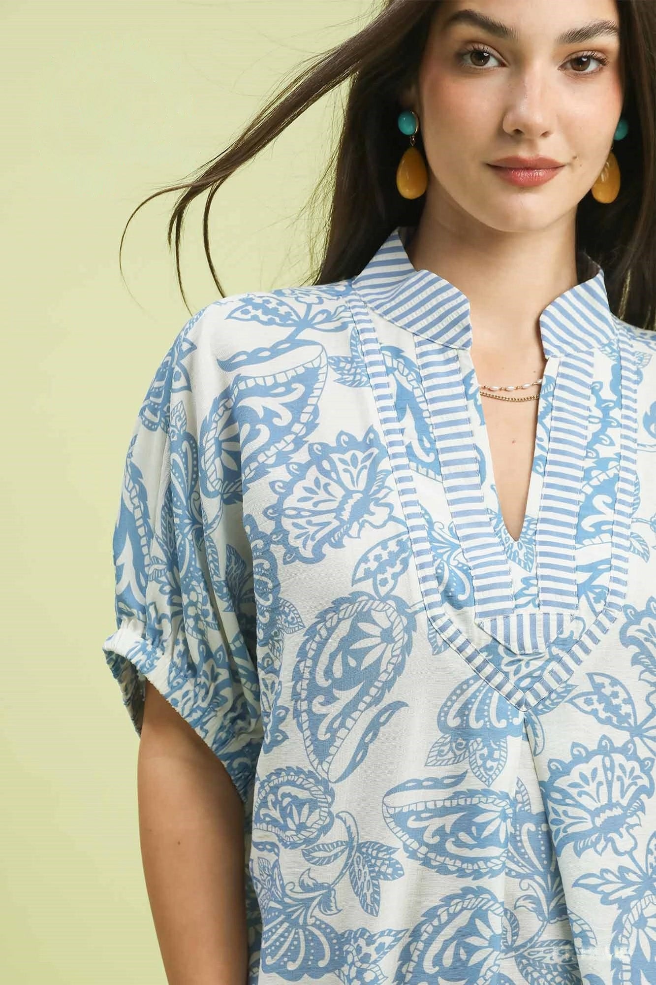 Blue Umgee botanical print mixed trim tunic top with relaxed fit and stylish design, perfect for casual wear.