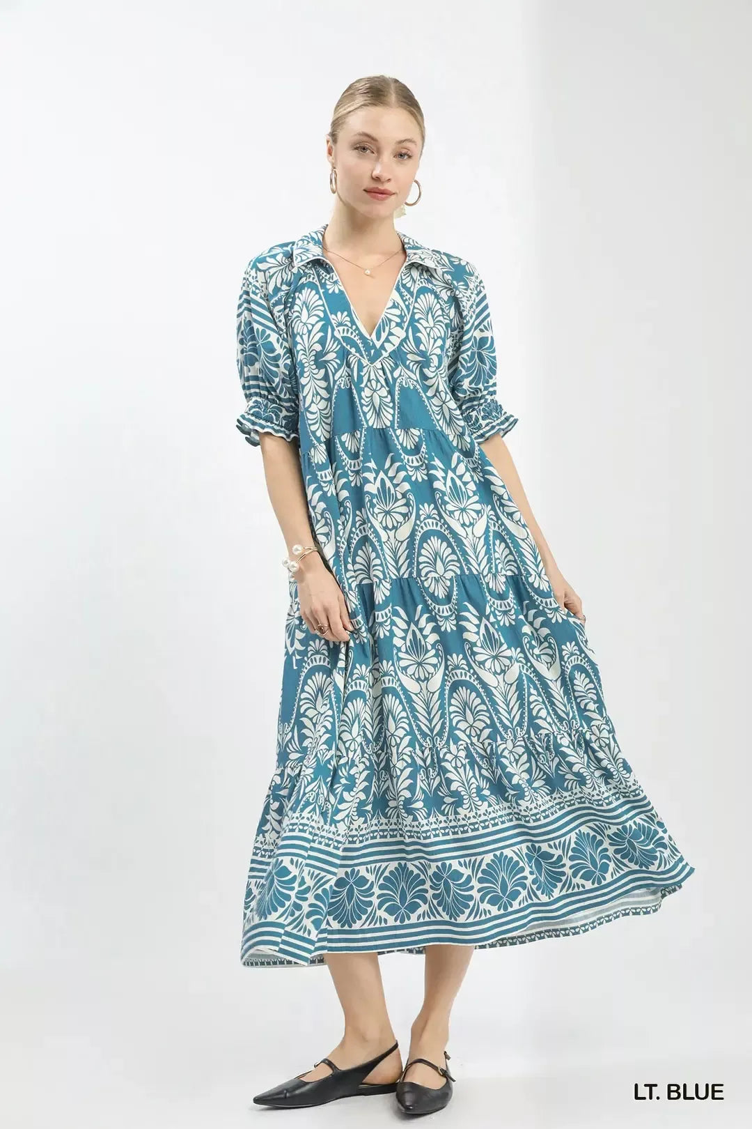 Light blue Umgee two-tone border print midi dress with a flowy silhouette and stylish design, perfect for casual or semi-formal wear.