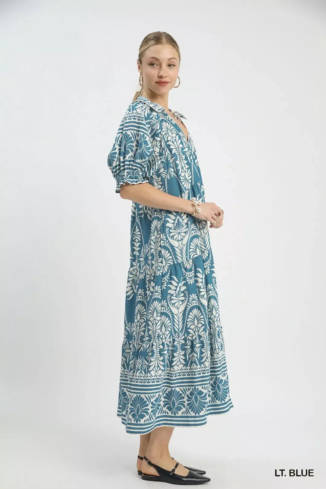 Light blue Umgee two-tone border print midi dress with flowing fabric and stylish design, perfect for casual or semi-formal wear.