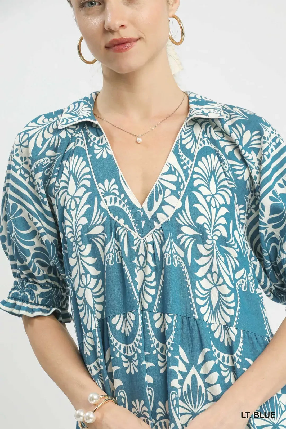 Light blue Umgee two-tone border print midi dress with a relaxed fit and sleeveless design, perfect for casual or summer wear.
