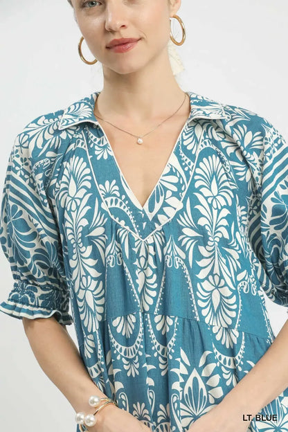 Light blue Umgee two-tone border print midi dress with a relaxed fit and sleeveless design, perfect for casual or summer wear.