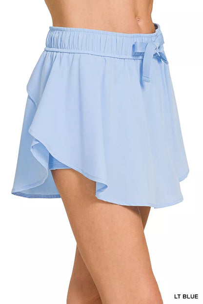 Light blue Zenana soft woven active skorts with pockets, designed for comfort and mobility, perfect for active wear.