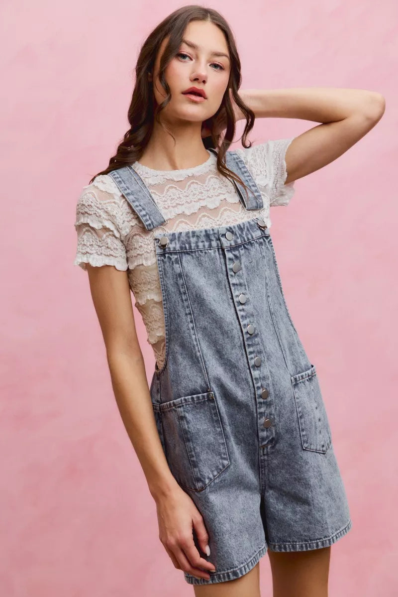 Denim washed romper with adjustable straps and front design, stylish Trendsi SO ME denim romper on a model.