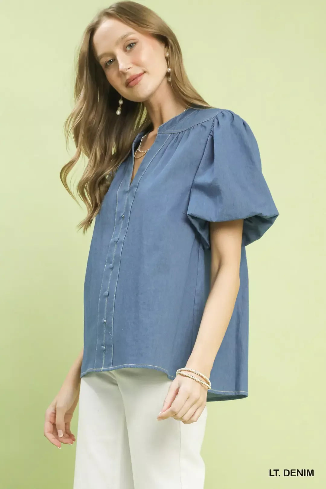 Light blue Umgee denim boho blouse with button front and puff sleeves, featuring a relaxed, casual style.