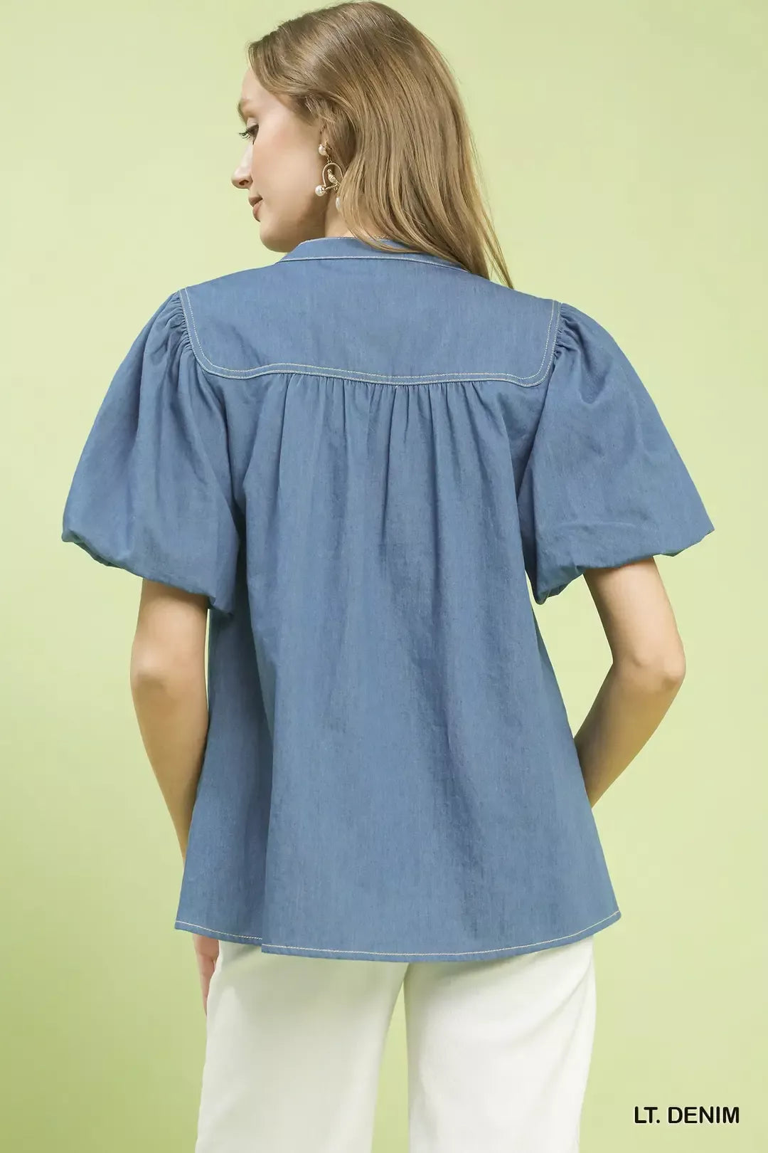 Umgee denim boho blouse with button front and puff sleeves, styled in a casual, trendy fashion.