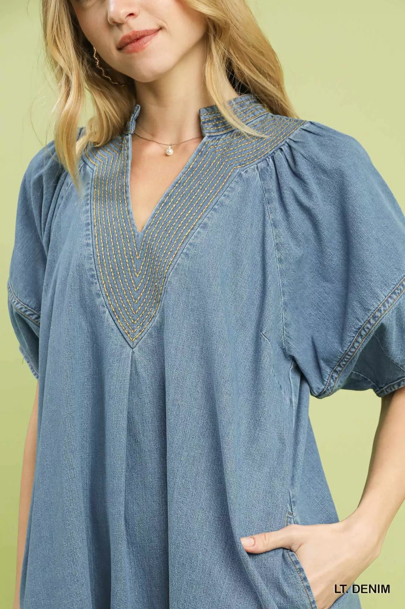 Umgee denim mini dress with contrast thread detailing, featuring a casual fit and stylish design.