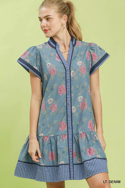 Umgee floral contrast trim ruffle hem mini dress with short sleeves, featuring a stylish pattern and feminine ruffle details.