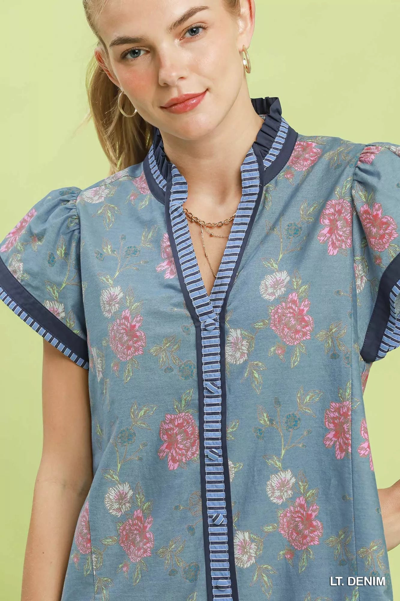Umgee floral contrast trim ruffle hem mini dress, casual sleeveless summer dress with floral pattern and stylish details.