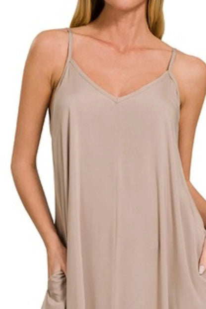 Mocha Zenana woven cami dress with arc hem, flowy pockets, and sleeveless design, styled for casual wear.