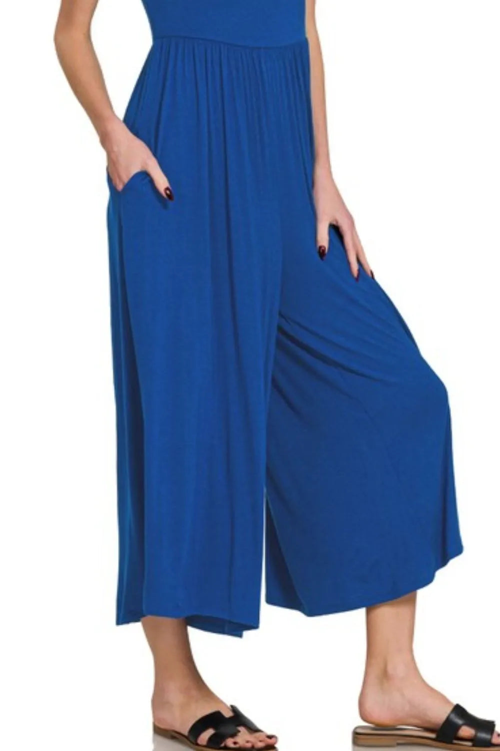 Navy Zenana double-layered short sleeve jumpsuit with a relaxed fit, featuring layered fabric and short sleeves.