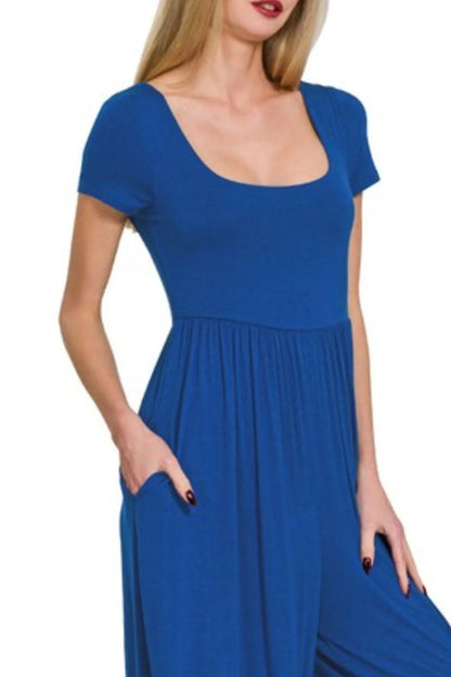 Navy Zenana double-layered short sleeve jumpsuit with a relaxed fit, displayed on a hanger.