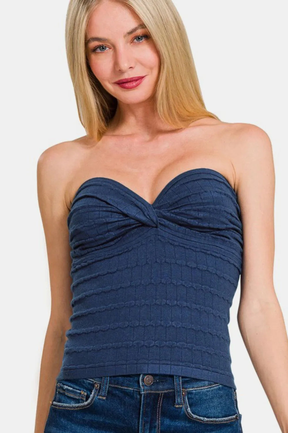 Navy Zenana Ruched Twisted Sweetheart Neck Top with fitted design and ruching detail, styled on a mannequin.