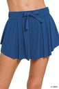 Navy Zenana tennis skirt by Trendsi with ruffle hem and hidden inner pockets, made from lightweight athletic fabric.