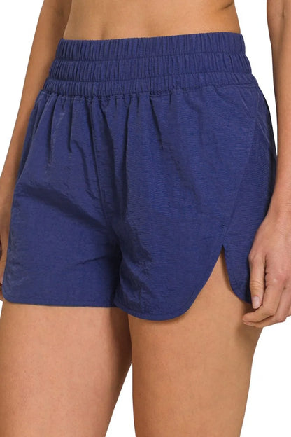 Navy Zenana windbreaker running shorts with smocked waistband, lightweight and comfortable for active wear.