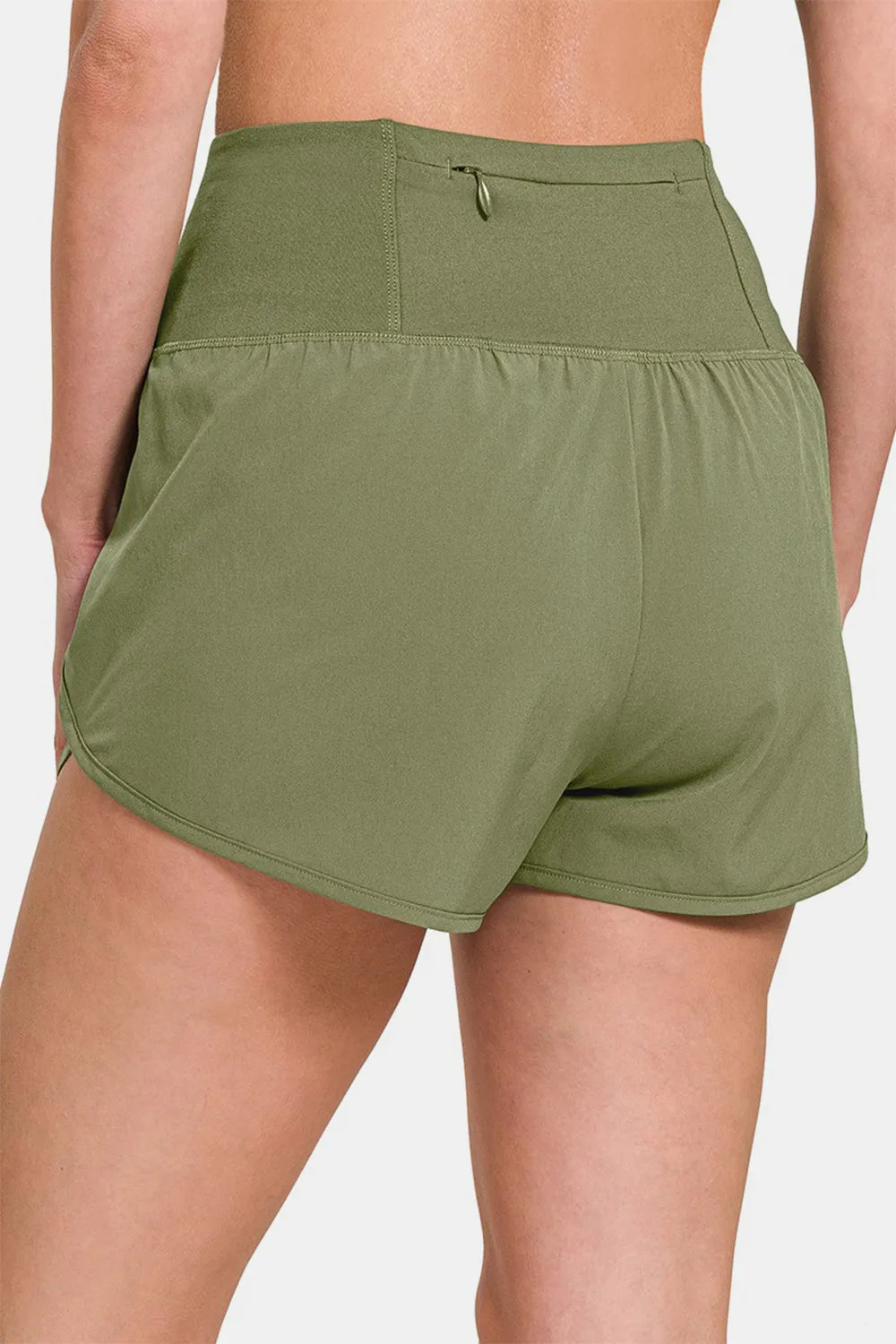 Olive green Zenana high-waisted active shorts with zippered back pocket, designed for comfort and style during workouts.