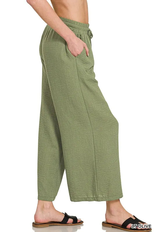 Olive green Zenana woven crepe cropped pants with elastic waistband, featuring a relaxed fit and stylish design.