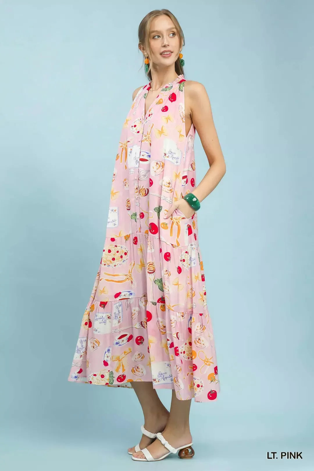 Pink abstract print tiered halter midi dress by Umgee, shown on a model, featuring a flowy silhouette and stylish design.