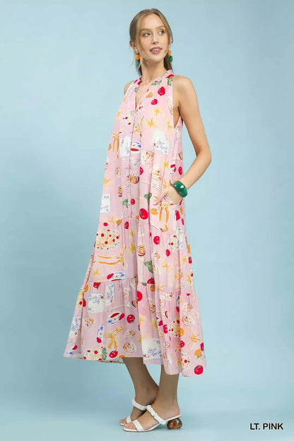 Pink abstract print tiered halter midi dress by Umgee, shown on a model, featuring a flowy silhouette and stylish design.