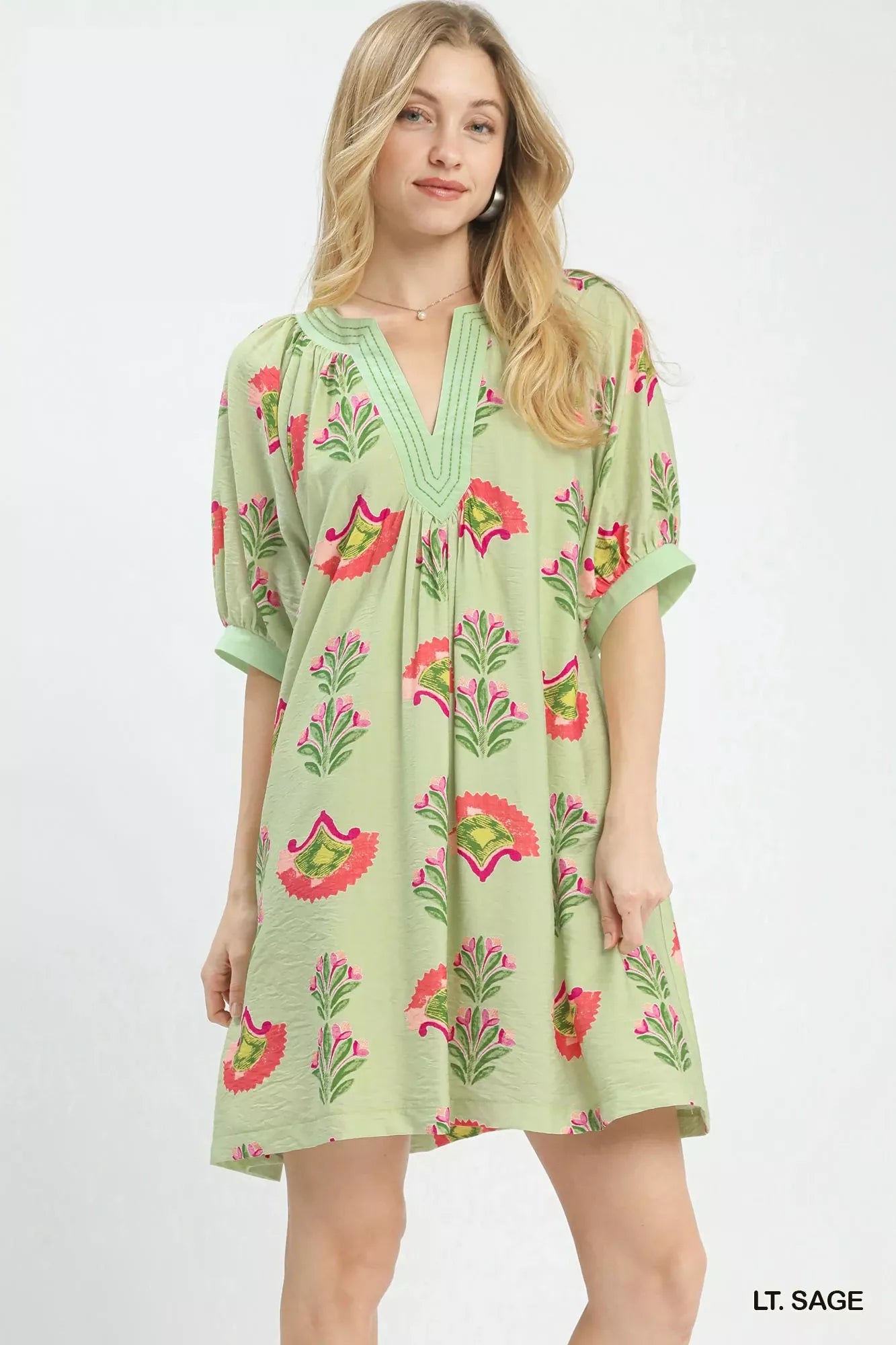 Sage green Umgee abstract print mini dress by Trendsi featuring a fitted silhouette and stylish short sleeves.