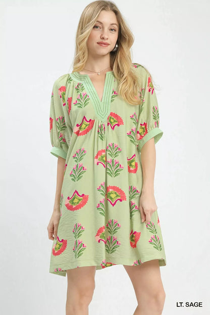 Sage green Umgee abstract print mini dress by Trendsi featuring a fitted silhouette and stylish short sleeves.