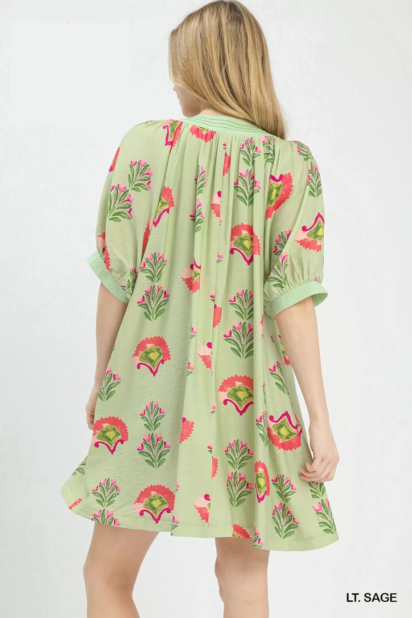 Sage green Umgee Abstract Print Mini Dress by Trendsi featuring a stylish, fitted silhouette and vibrant abstract pattern.