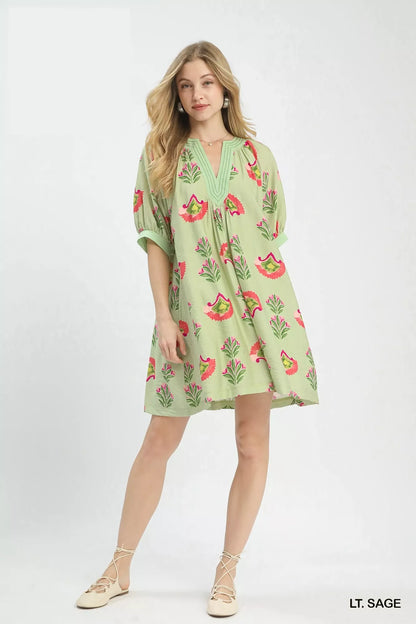Sage green Umgee abstract print mini dress with short sleeves and flowy silhouette, perfect for casual or summer wear.
