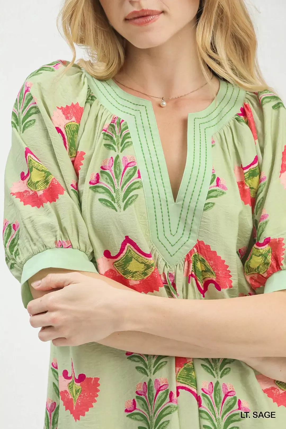 Light sage Umgee abstract print mini dress by Trendsi featuring a stylish, flowy design and vibrant pattern perfect for casual wear.