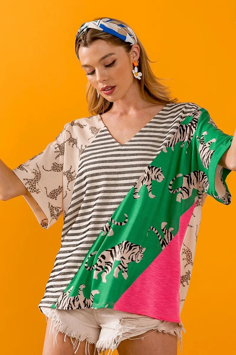 Taupe green V-neck top by Trendsi featuring bold tiger stripe contrast color blocks and a stylish, modern design.