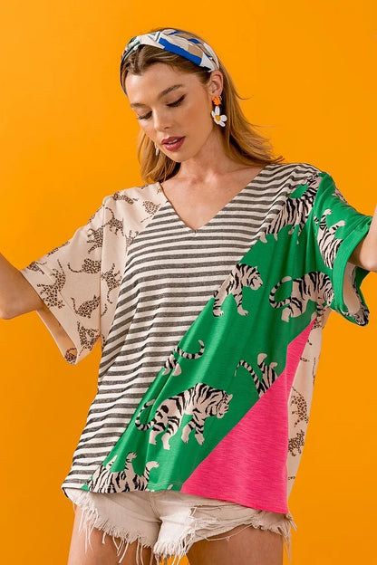 Taupe green V-neck top by Trendsi featuring bold tiger stripe contrast color blocks and a stylish, modern design.