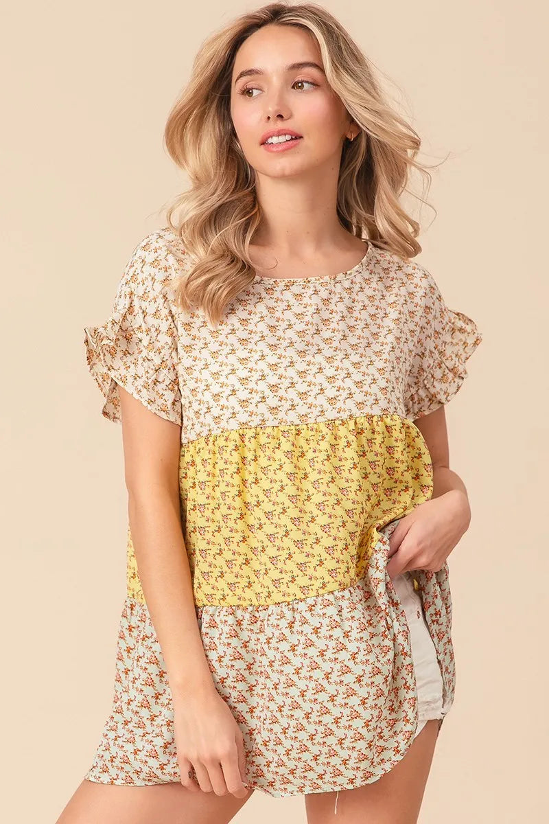Trendsi BiBi floral printed woven color block and tiered top in yellow and sage, featuring a stylish, layered design.