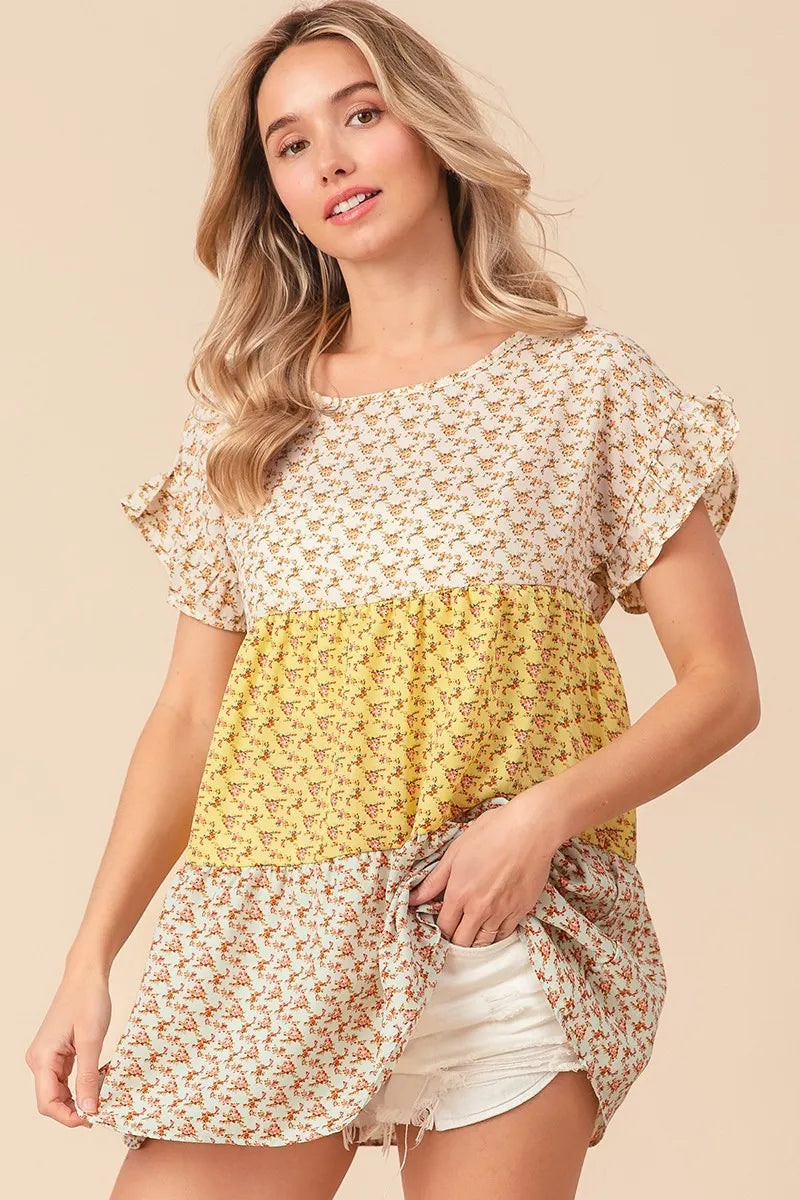 Trendsi BiBi floral printed woven color block and tiered top in yellow and sage with a relaxed fit and flowy design.