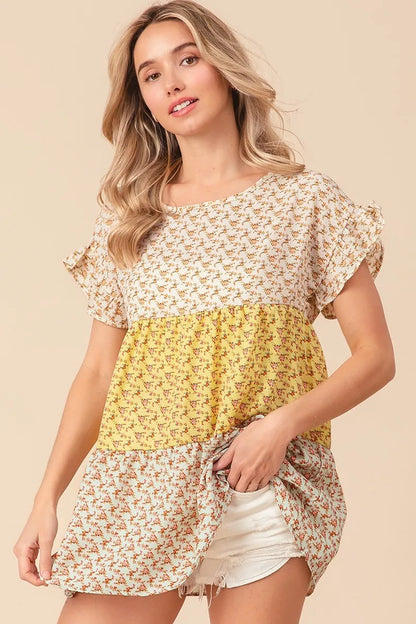 Trendsi BiBi floral printed woven color block and tiered top in yellow and sage with a relaxed fit and flowy design.