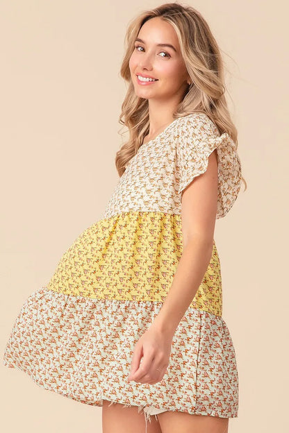 Trendi floral printed woven color block and tiered top in yellow and sage with a relaxed fit and lightweight fabric.