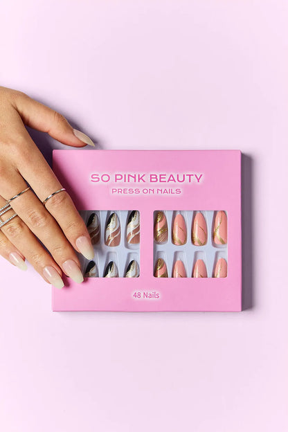 Marbled pink press-on nails by Trendsi, two packs of stylish, easy-to-apply short nail extensions with a chic design.