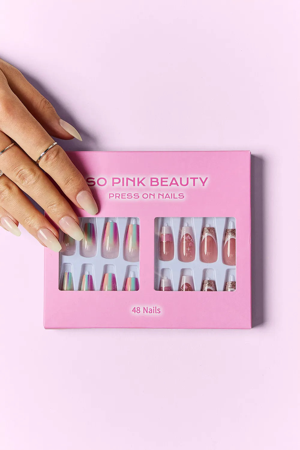 Marbled pink press-on nails from Trendsi's SO PINK BEAUTY collection, featuring two packs of stylish, easy-to-apply nail extensions.