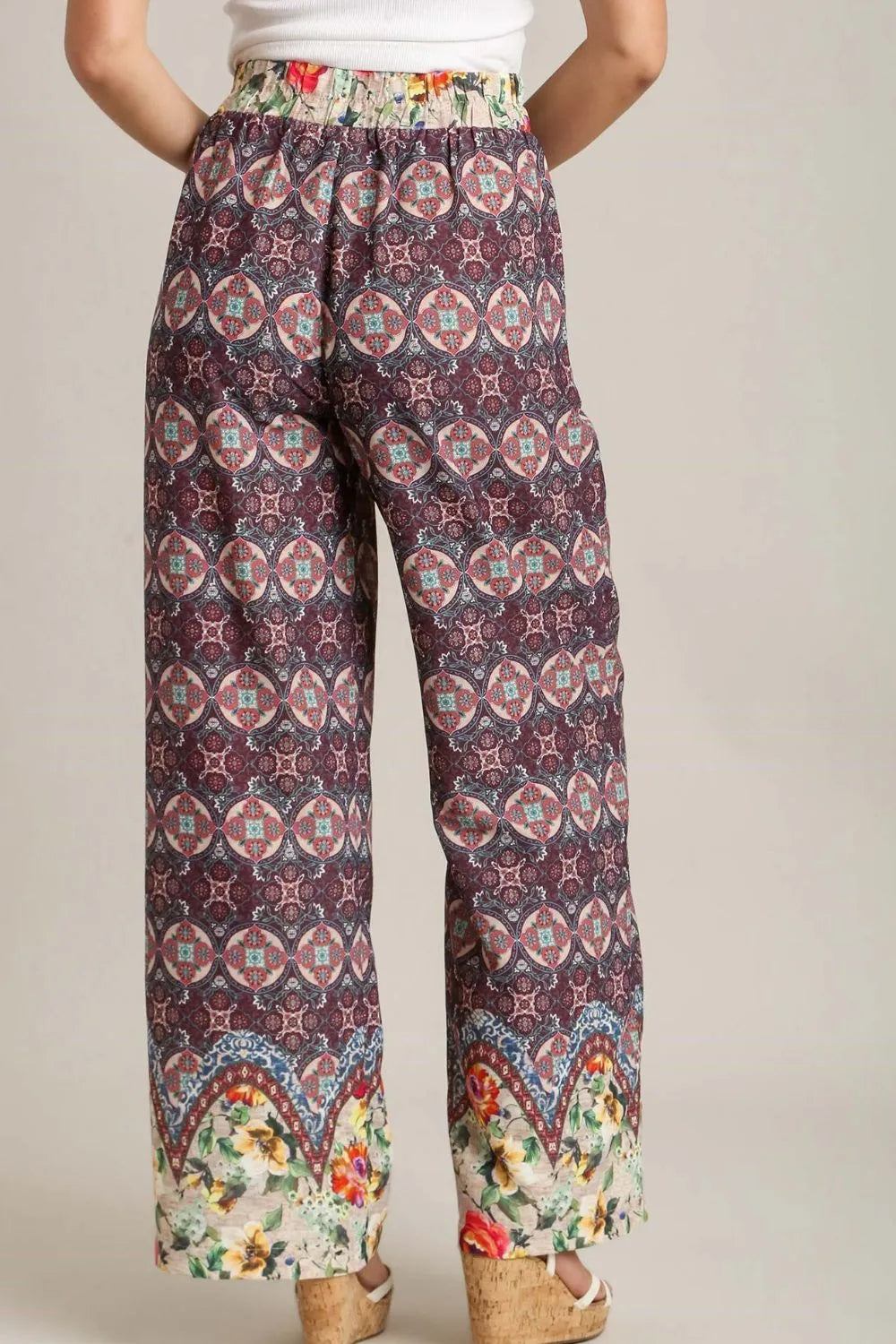 Plus size Umgee mixed print elastic waistband pants in maroon, featuring a relaxed fit and comfortable design.