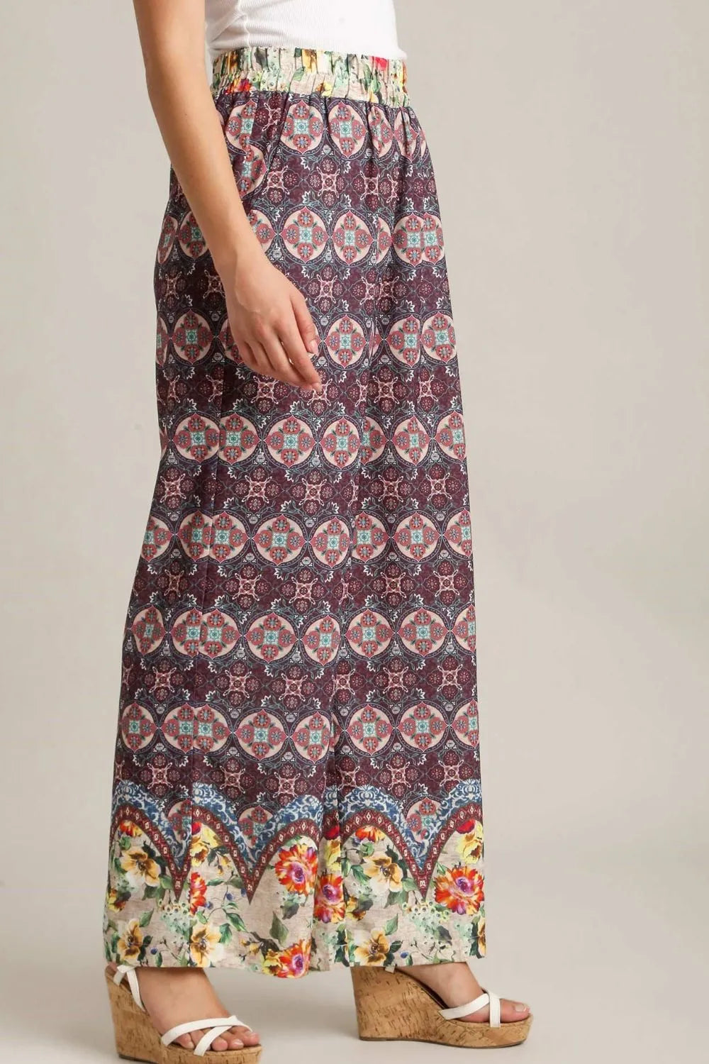 Plus size Umgee mixed print elastic waistband pants in maroon, featuring a comfortable full-length design and stylish pattern.