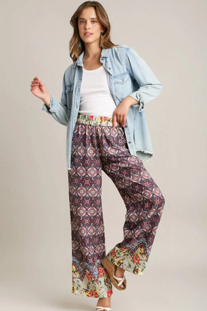 Plus size Umgee mixed print elastic waistband pants in maroon with a relaxed fit and stylish design.