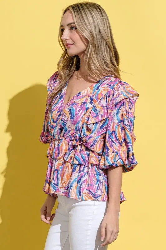 Mauve multi-print lantern sleeve blouse by Trendsi with relaxed fit and stylish design.