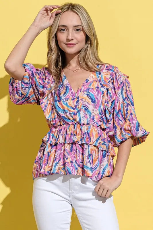 Mauve multi-colored lantern sleeve blouse by Trendsi with printed design and relaxed fit, styled on a model.