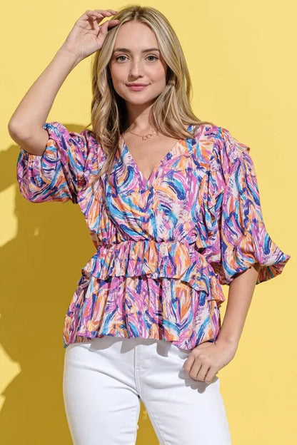 Mauve multi-colored lantern sleeve blouse by Trendsi with printed design and relaxed fit, styled on a model.