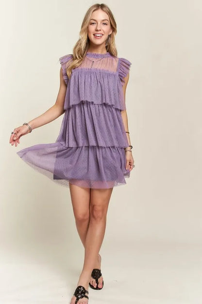 Mauve ADORA layered ruffled cap sleeve mesh dress by Trendsi, showcasing feminine design with ruffles and sheer mesh fabric.