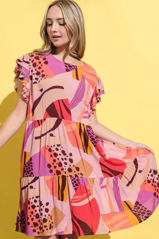 Mauve printed double ruffle sleeve dress by And The Why, featuring a flowy silhouette and stylish ruffle details.