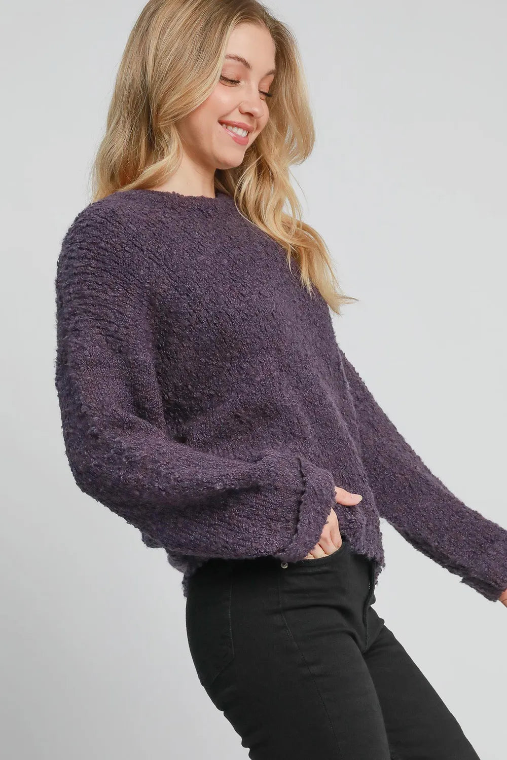 Plus size mauve Umgee boucle sweater with a round neck and long sleeves, featuring a cozy textured knit from Trendsi.